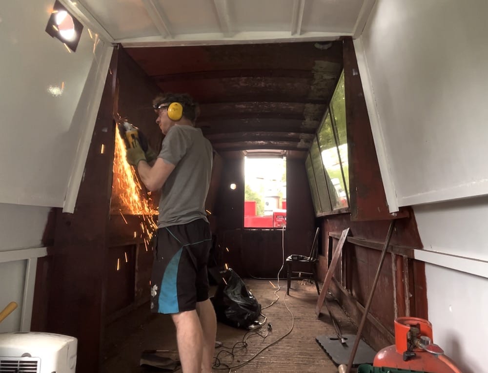 Performing surgery on the boat with an angle grinder