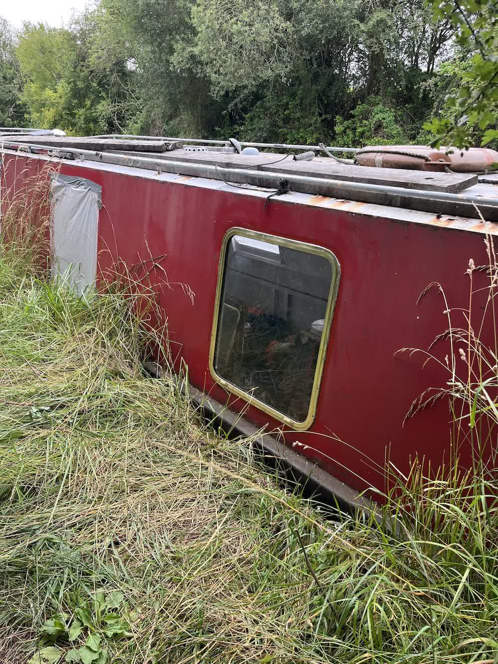 Installing first saloon window, inside