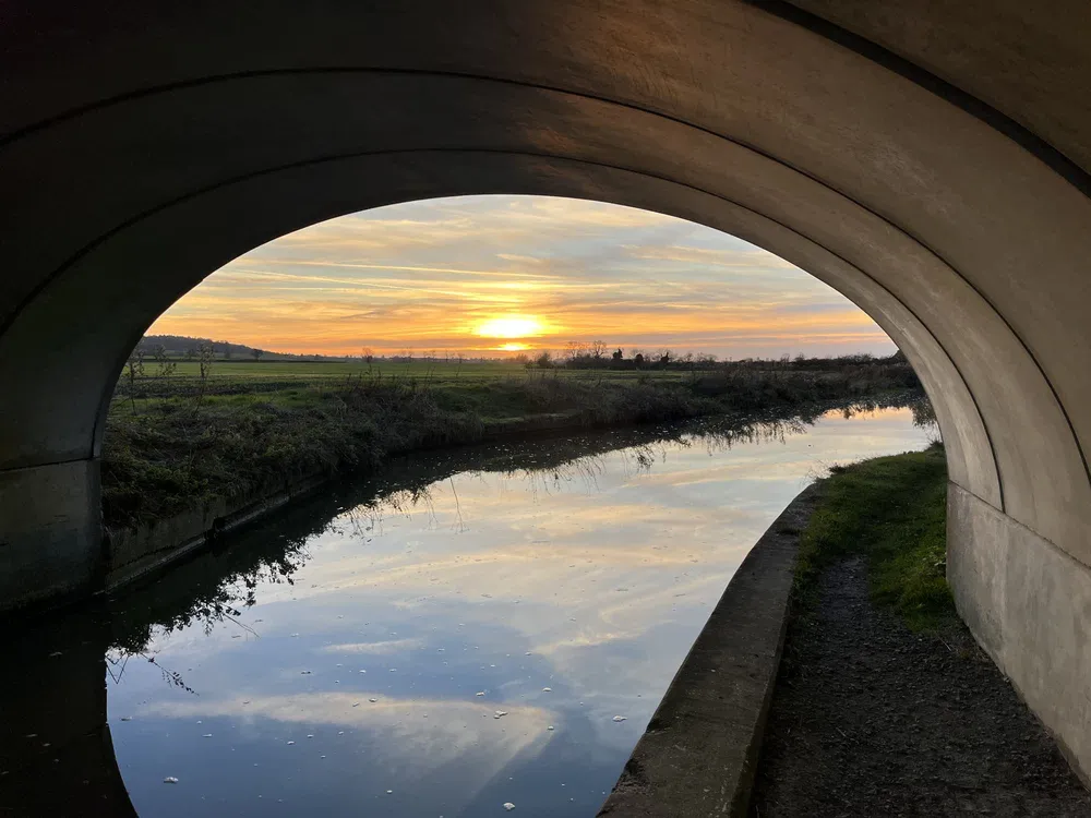 Sunset under a bridge